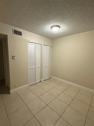 an empty room with a empty space and a window