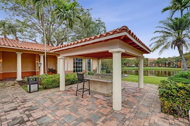 a view of a patio with a table and chairs