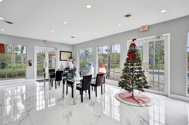 a kitchen with a refrigerator and cabinets