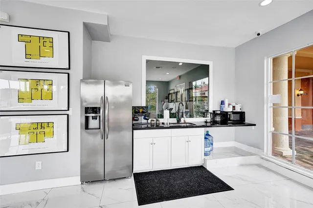 a very nice looking dining room with a large window