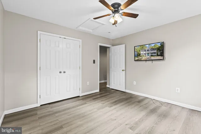 a view of an empty room with a fan