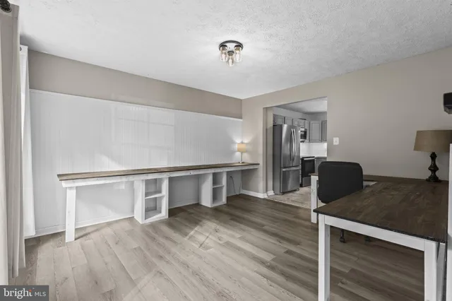 a view of a livingroom with furniture and wooden floor