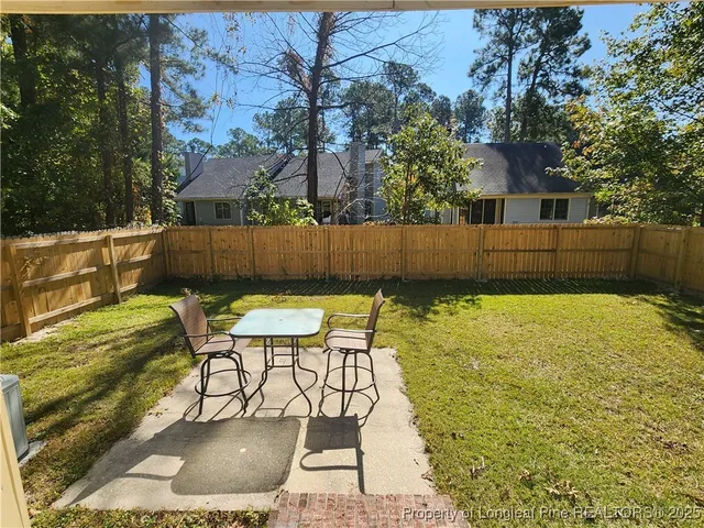 a view of swimming pool with a patio