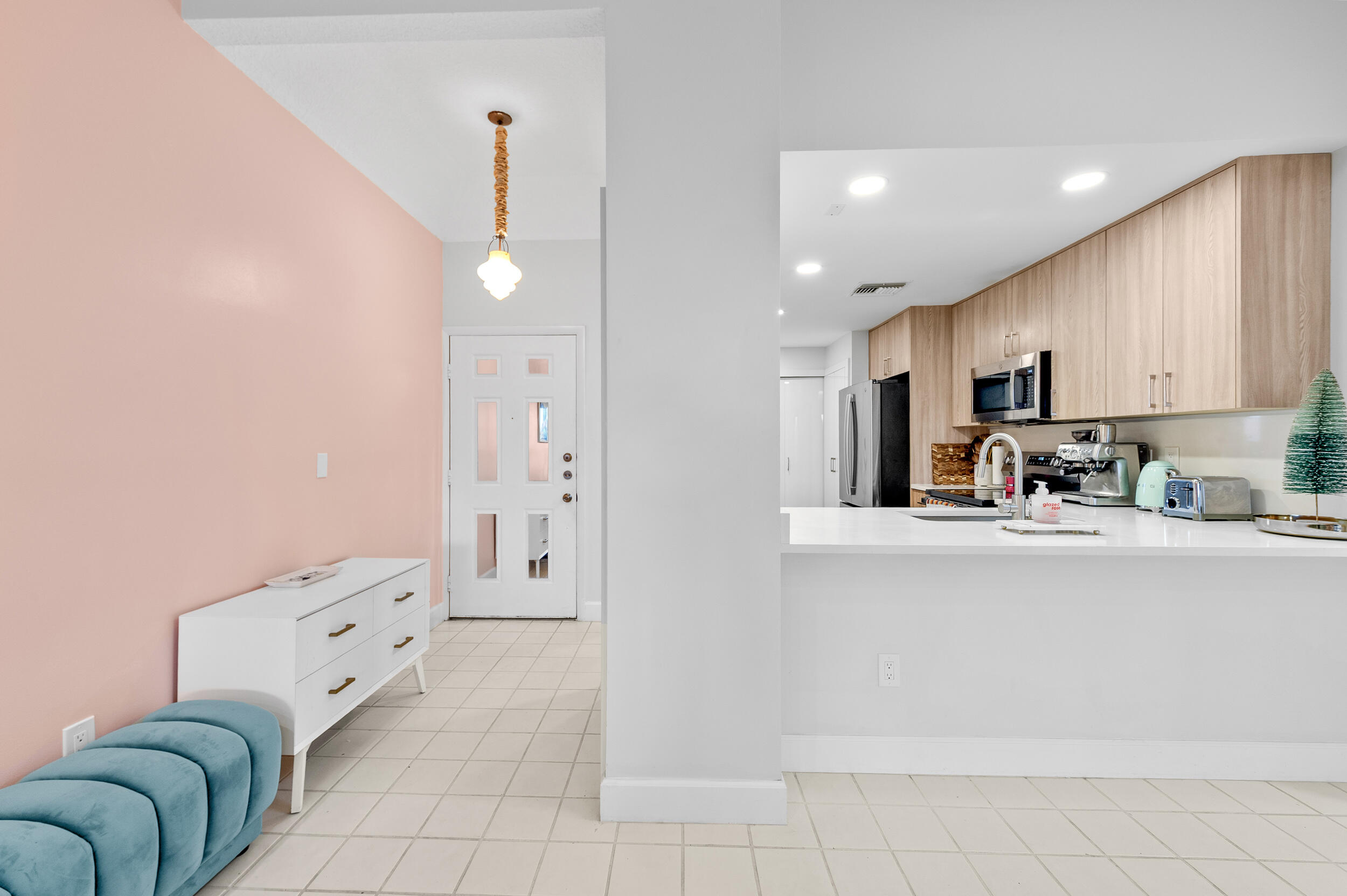 7460 La Paz Boulevard, Unit 304 Boca Raton, FL 33433 - Photo 24 of 37 a kitchen with stainless steel appliances a refrigerator sink and cabinets