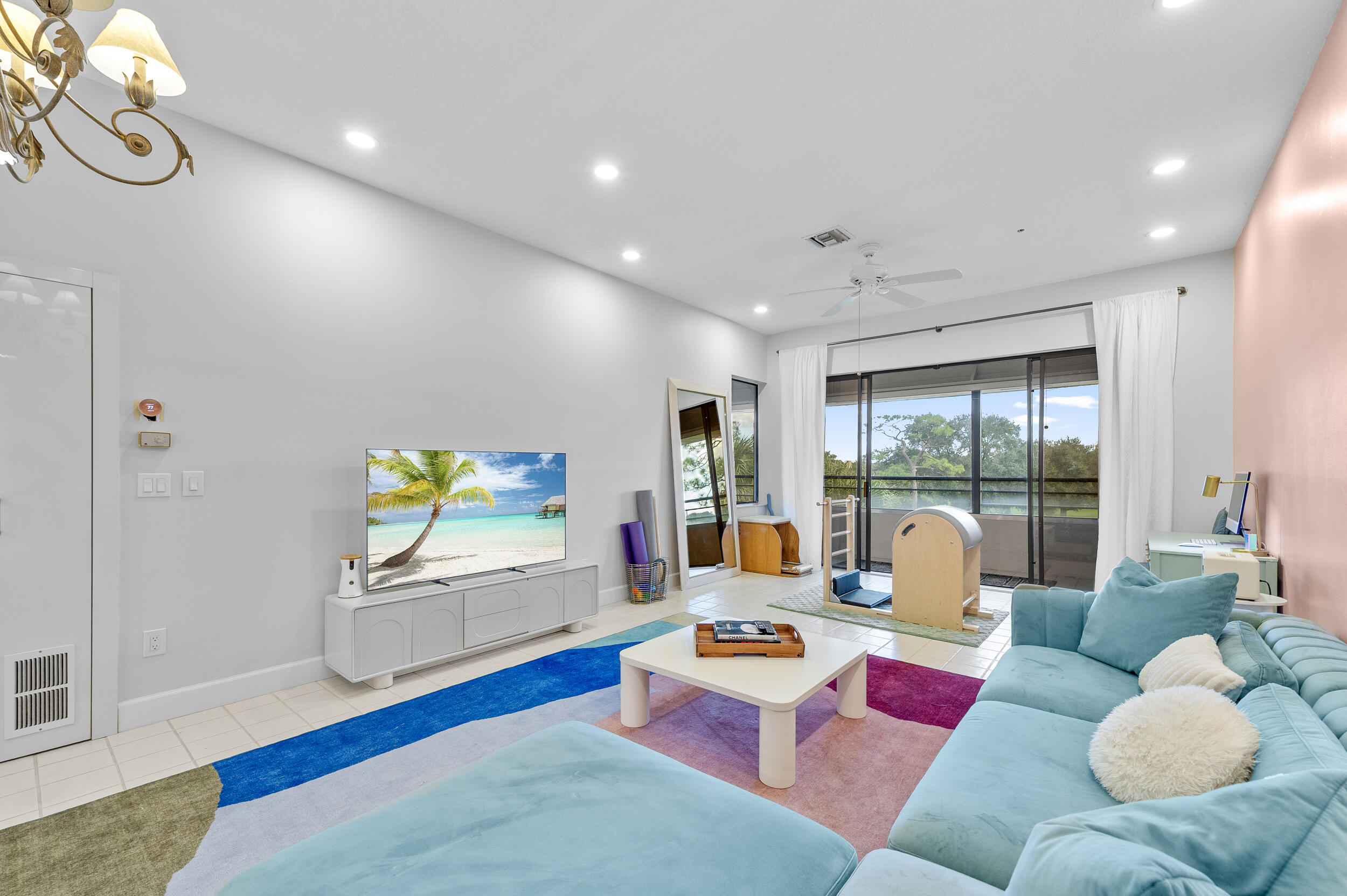 7460 La Paz Boulevard, Unit 304 Boca Raton, FL 33433 - Photo 34 of 37 a living room with furniture and a wooden floor