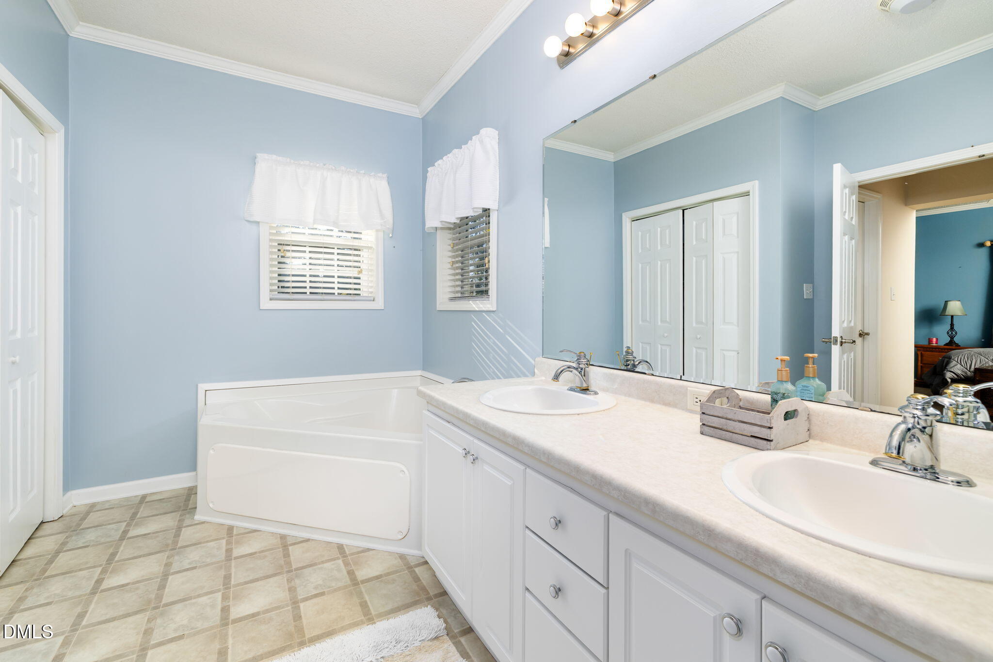 3900 Dabney Road Henderson, NC 27537 - Photo 15 of 35 a bathroom with a sink a vanity and a mirror