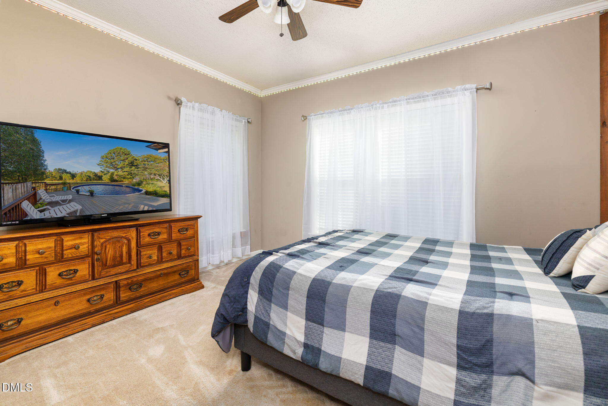 3900 Dabney Road Henderson, NC 27537 - Photo 17 of 35 a bedroom with a bed and a dresser