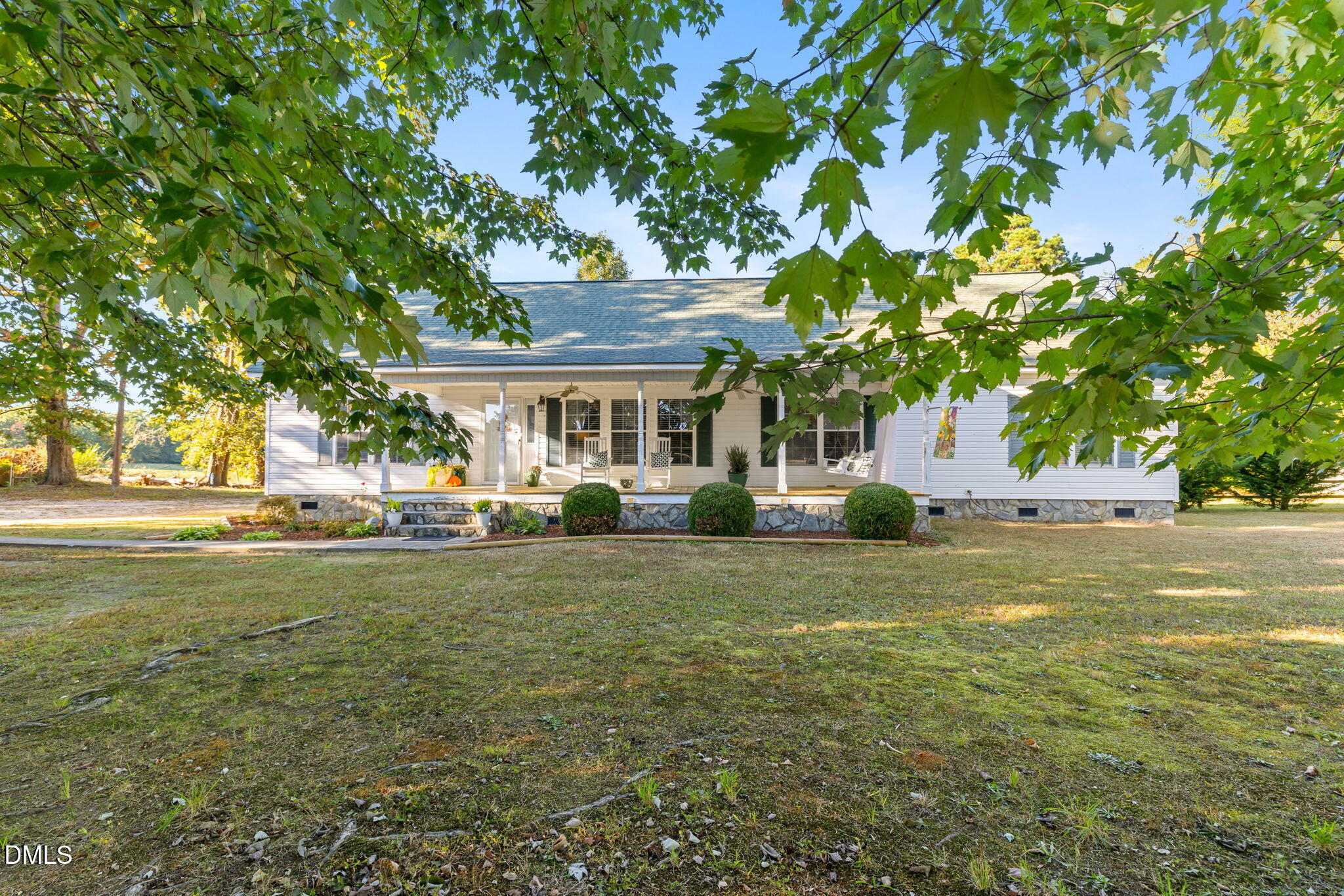 3900 Dabney Road Henderson, NC 27537 - Photo 2 of 35 a front view of a house with a garden