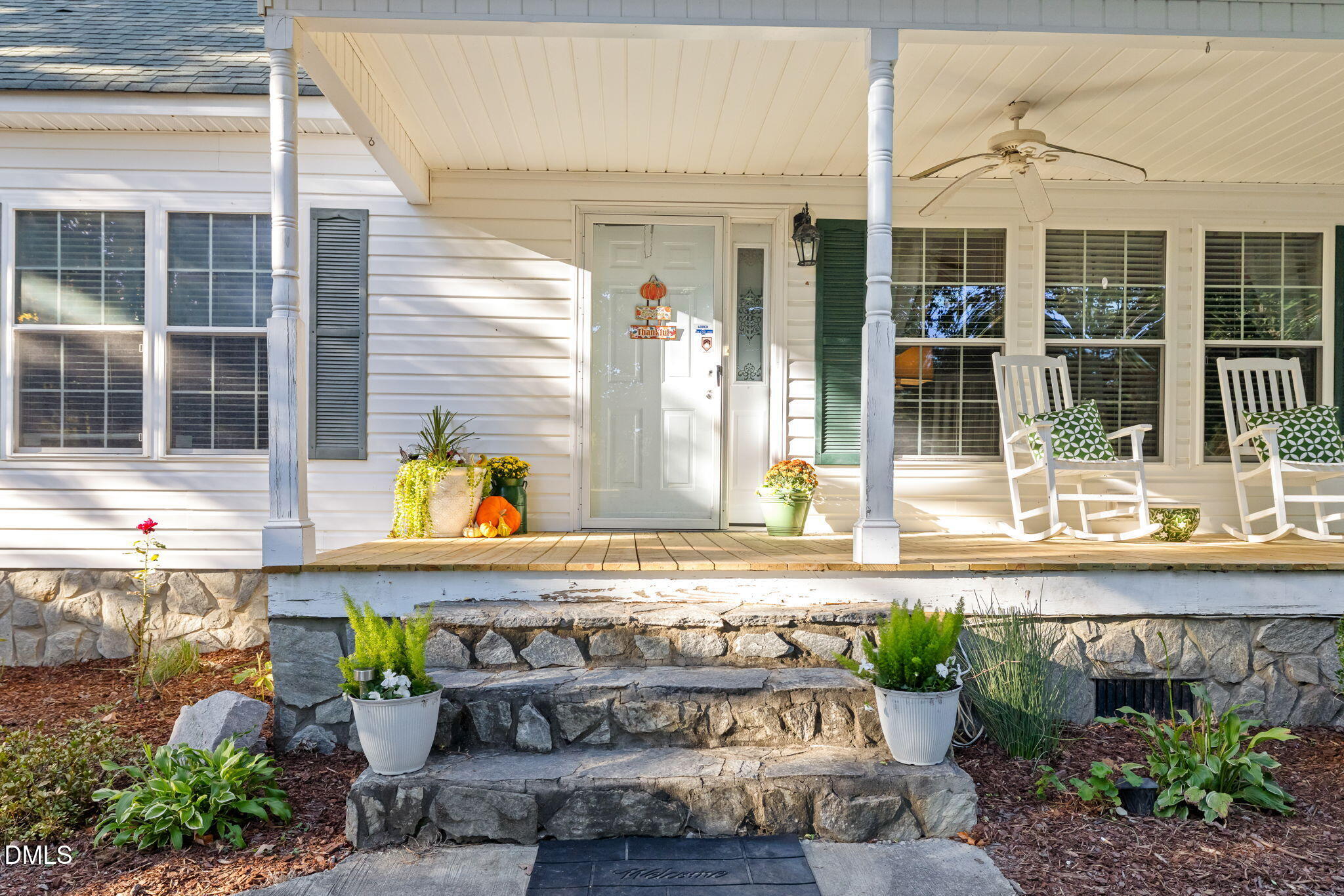 3900 Dabney Road Henderson, NC 27537 - Photo 23 of 35 a front view of a house with a yard glass top table and chairs