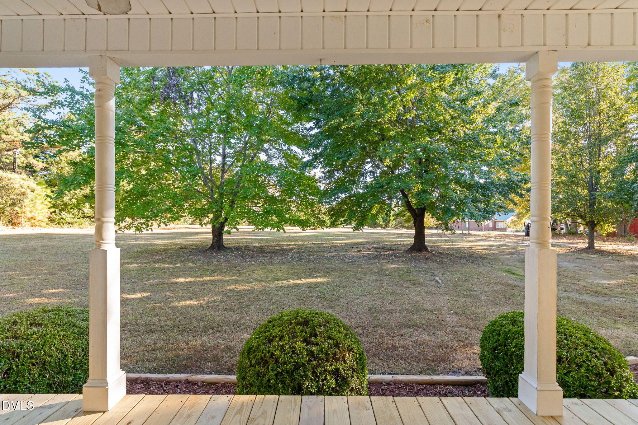3900 Dabney Road Henderson, NC 27537 - Photo 24 of 35 a view of a yard with plants and trees with wooden fence