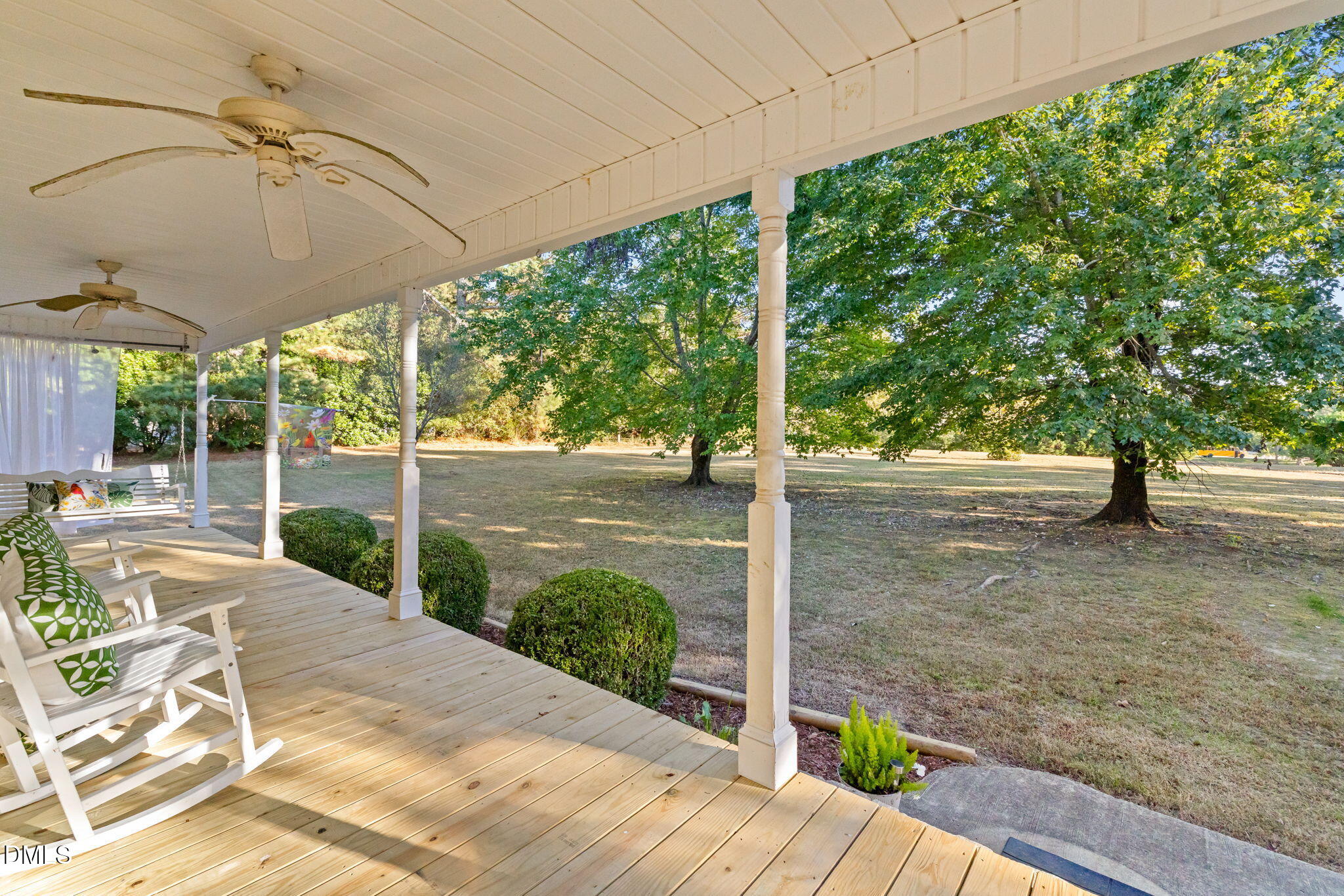 3900 Dabney Road Henderson, NC 27537 - Photo 26 of 35 a view of a patio with table and chairs under an umbrella