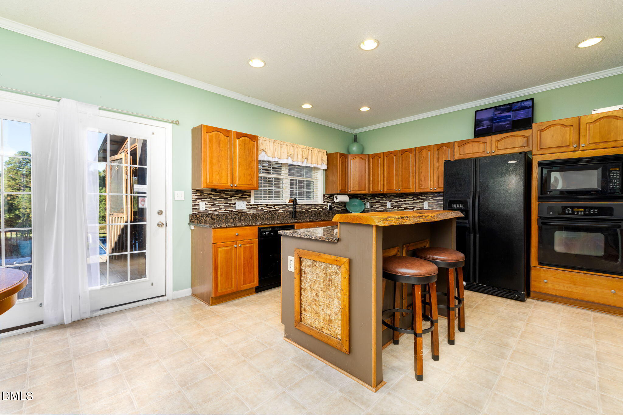 3900 Dabney Road Henderson, NC 27537 - Photo 3 of 35 a kitchen with stainless steel appliances granite countertop a refrigerator and a stove top oven