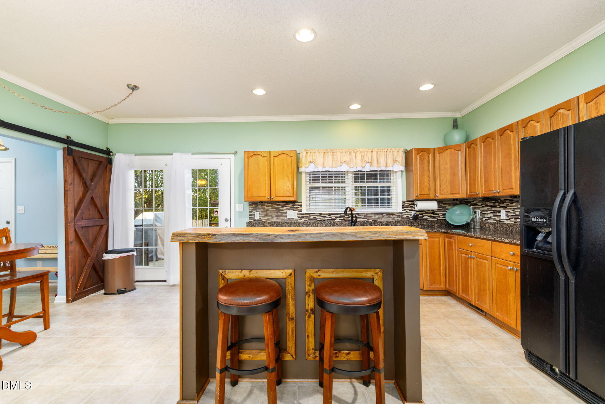 3900 Dabney Road Henderson, NC 27537 - Photo 4 of 35 a kitchen with stainless steel appliances granite countertop a refrigerator a stove top oven and a refrigerator