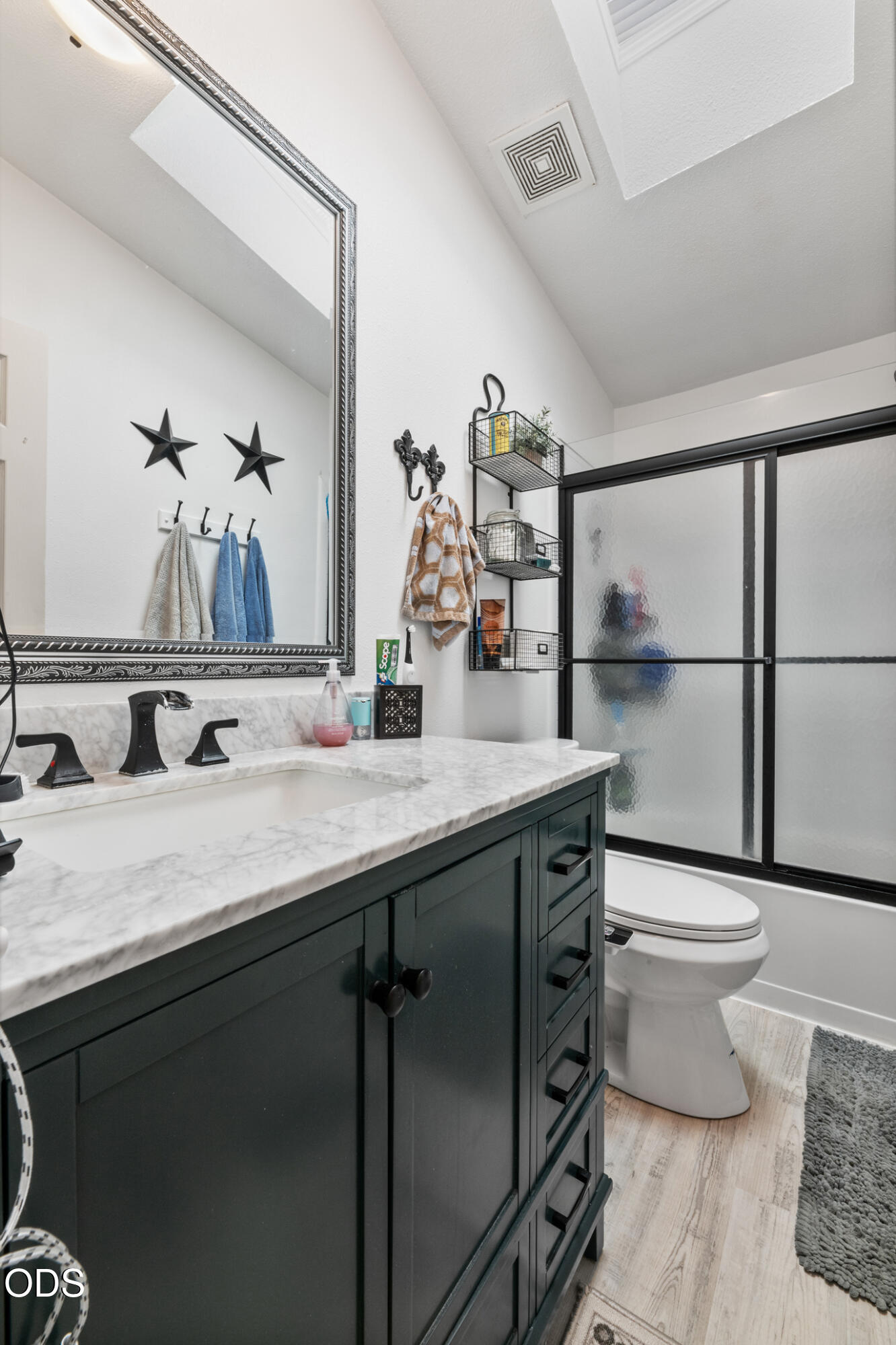 690 Foots Creek Road Gold Hill, OR 97525 - Photo 22 of 45 a bathroom with a granite countertop sink a toilet and a mirror