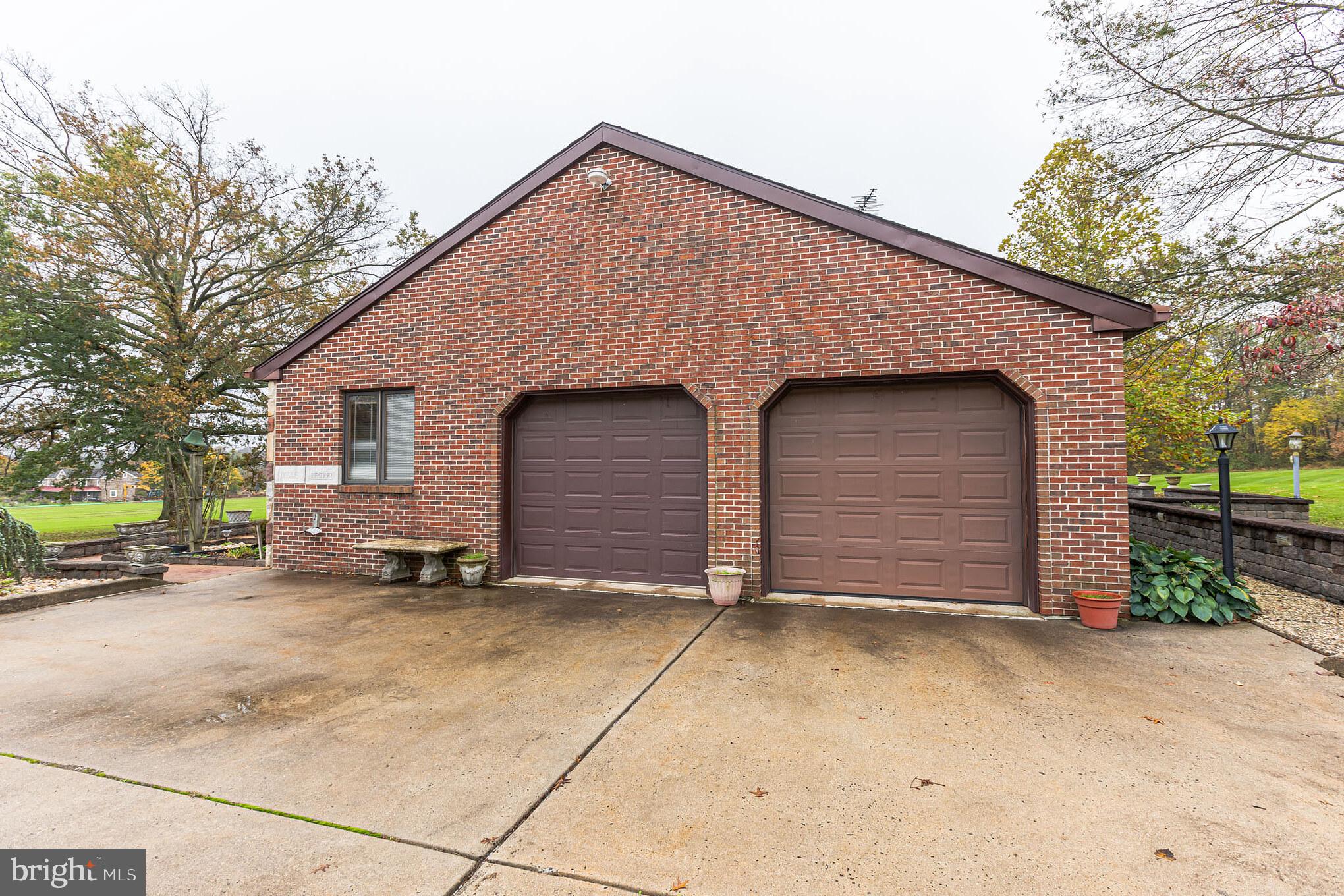 114 Curley Mill Road Chalfont, PA 18914 - Photo 4 of 36 Brick Side with Expanded Concrete Driveway