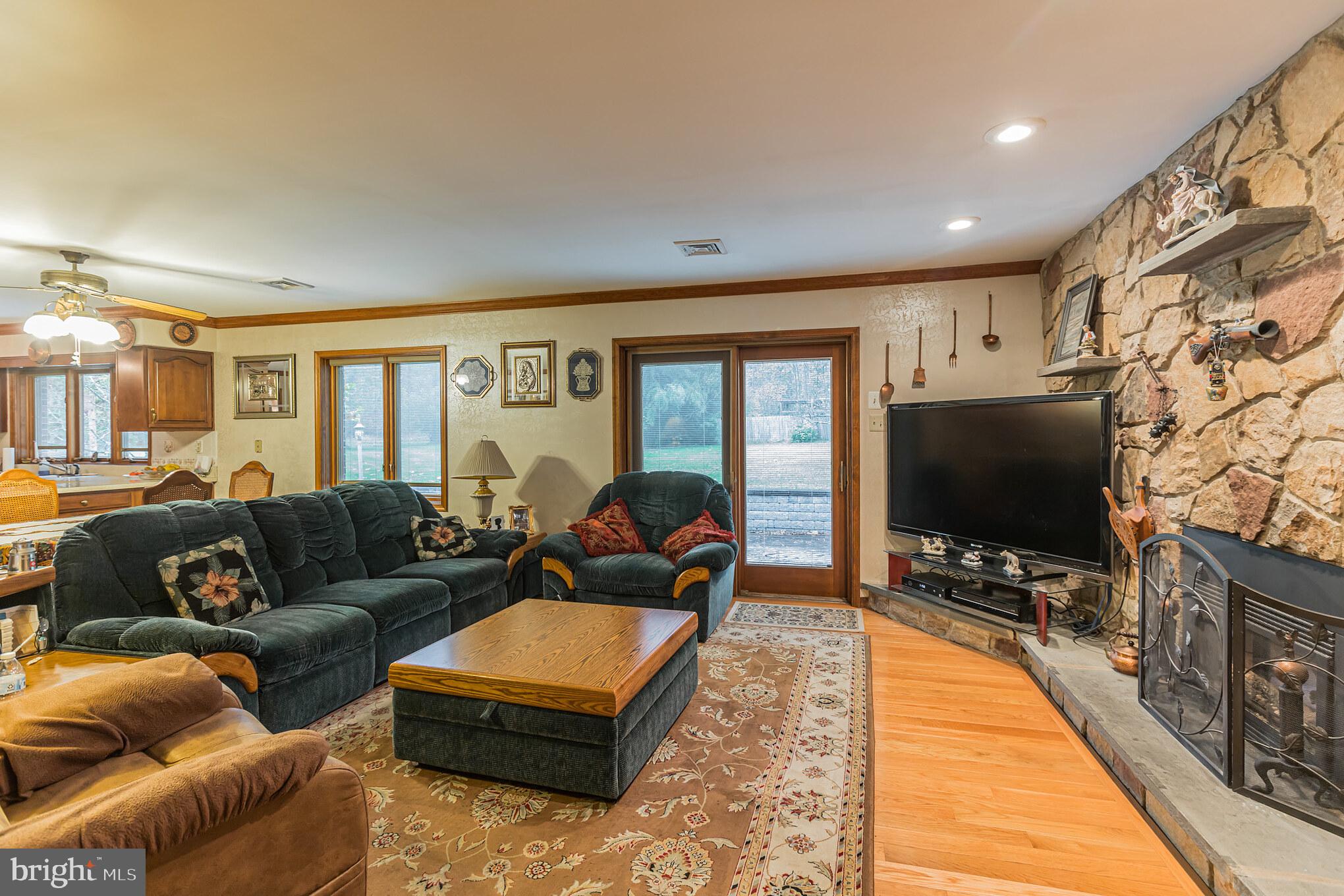 114 Curley Mill Road Chalfont, PA 18914 - Photo 6 of 36 Family Room with Solid Stone Fireplace