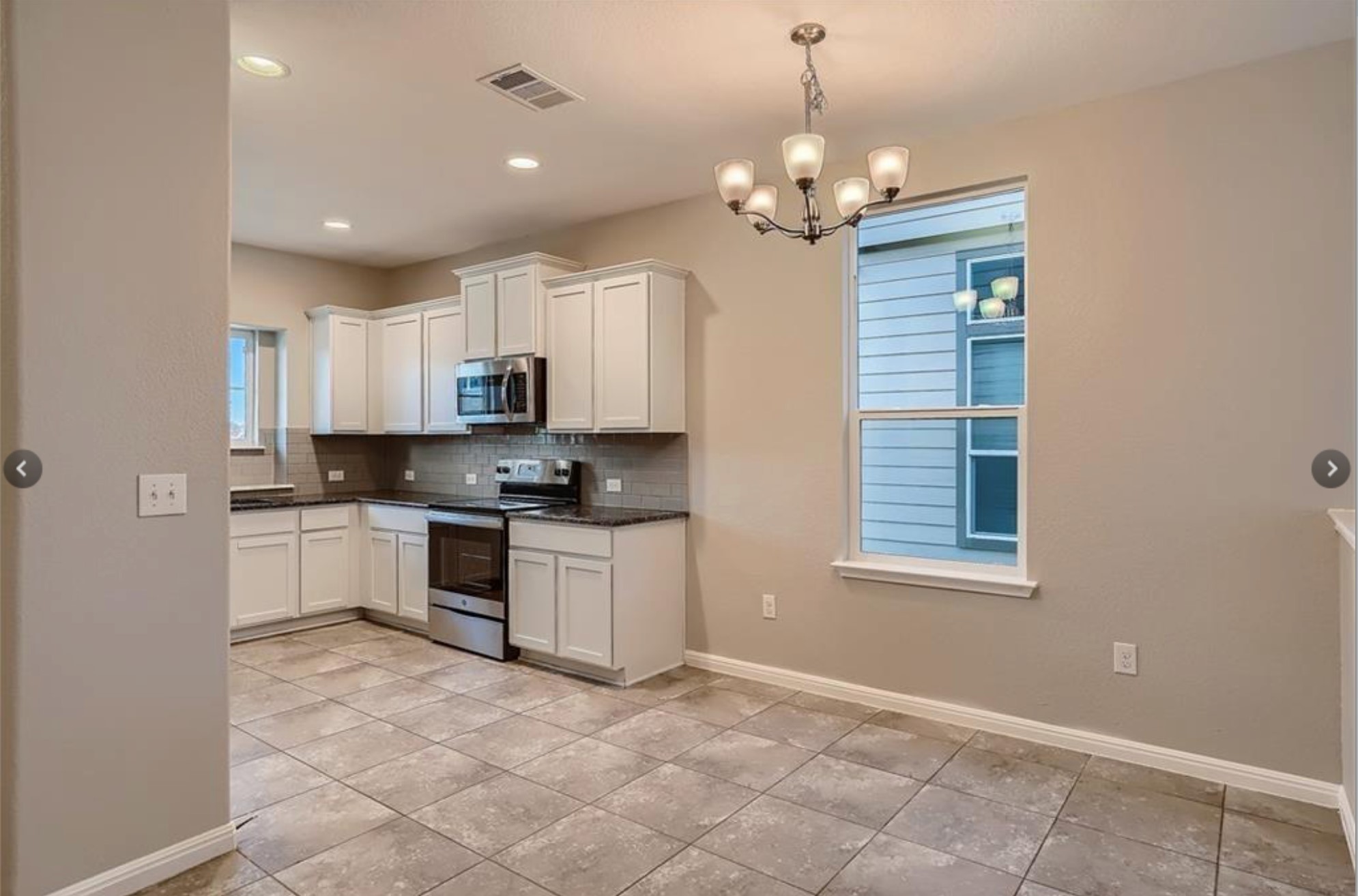 304 Cane River Road Pflugerville, TX 78660 - Photo 11 of 31 Culinary delights await in this modern kitchen with stainless steel appliances and abundant cabinetry.