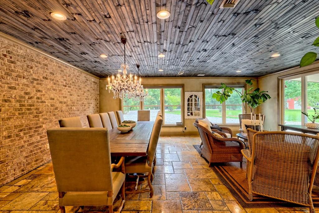 1422 Wolffork Road Rabun Gap, GA 30568 - Photo 12 of 78 a dining room with furniture a rug and a chandelier