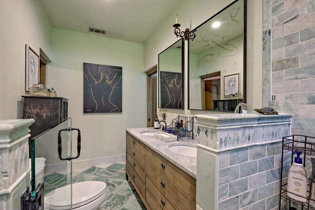 1422 Wolffork Road Rabun Gap, GA 30568 - Photo 20 of 78 a bathroom with a double vanity sink toilet mirror and shower