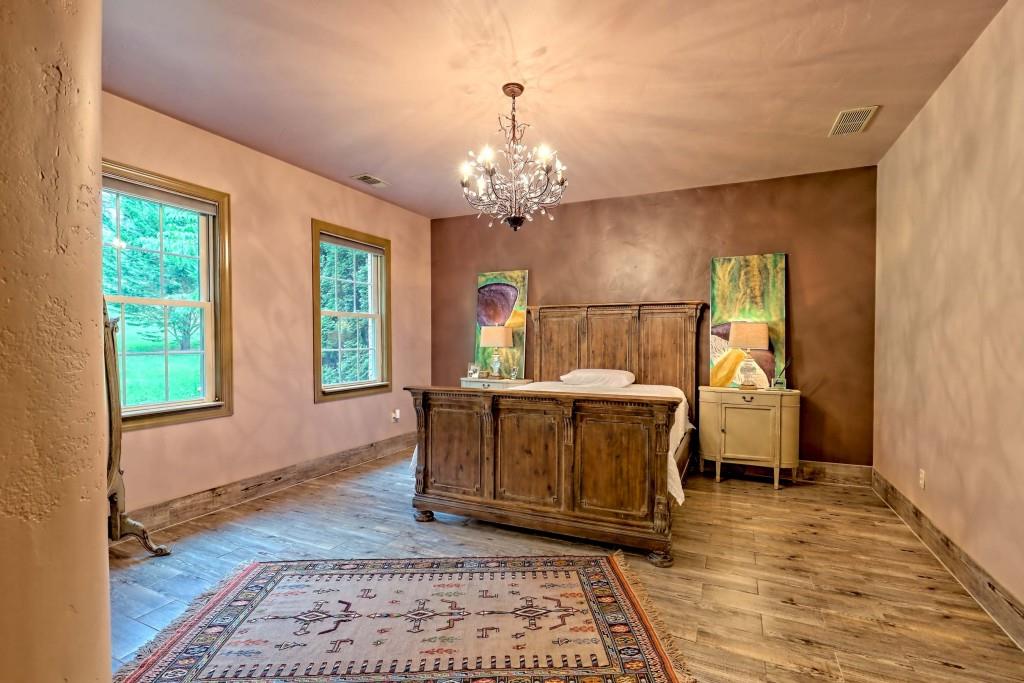 1422 Wolffork Road Rabun Gap, GA 30568 - Photo 21 of 78 a view of a dining room with furniture window and wooden floor