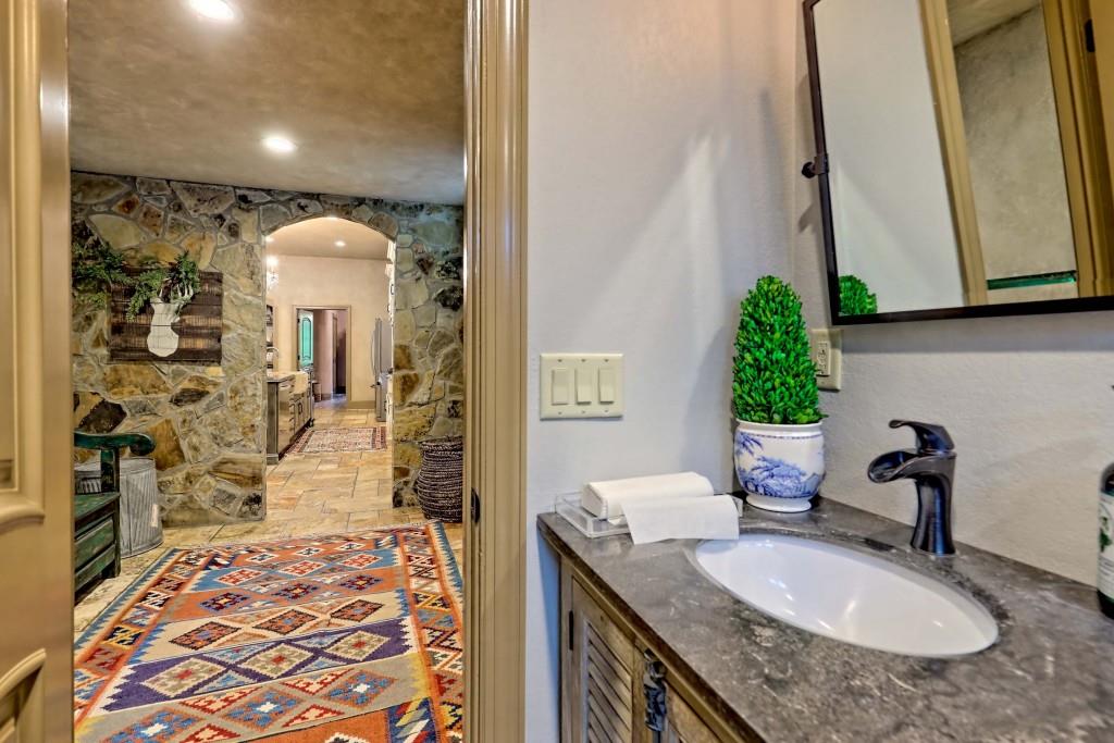 1422 Wolffork Road Rabun Gap, GA 30568 - Photo 26 of 78 a bathroom with a granite countertop sink and a mirror