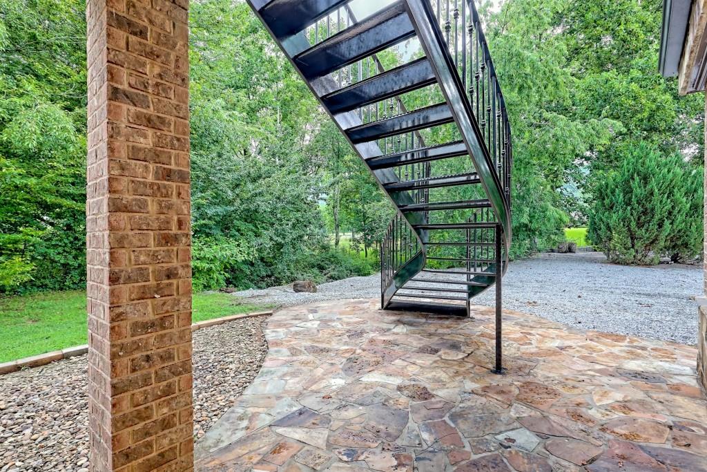 1422 Wolffork Road Rabun Gap, GA 30568 - Photo 34 of 78 a backyard of a house with lots of green space