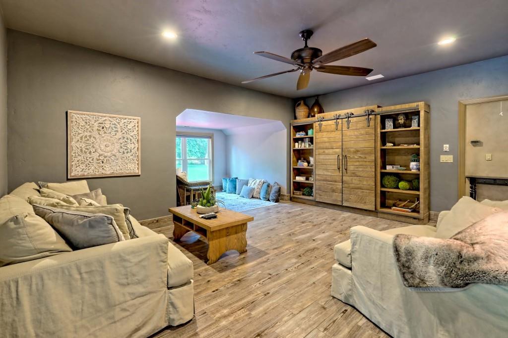 1422 Wolffork Road Rabun Gap, GA 30568 - Photo 40 of 78 a living room with furniture and a ceiling fan
