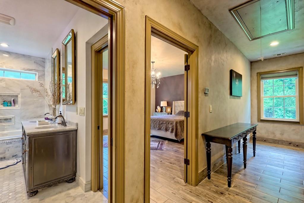 1422 Wolffork Road Rabun Gap, GA 30568 - Photo 44 of 78 a view of a hallway with furniture and wooden floor