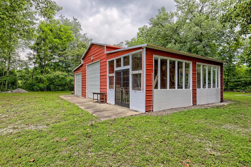 1422 Wolffork Road Rabun Gap, GA 30568 - Photo 57 of 78 a view of a house with yard and deck