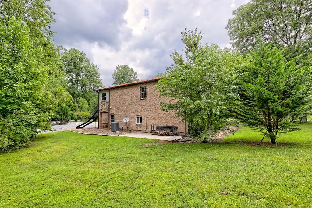 1422 Wolffork Road Rabun Gap, GA 30568 - Photo 60 of 78 a view of a house with backyard and sitting area