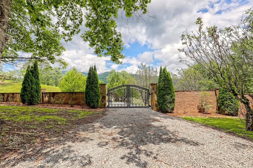 1422 Wolffork Road Rabun Gap, GA 30568 - Photo 69 of 78 a backyard of a house with lots of green space