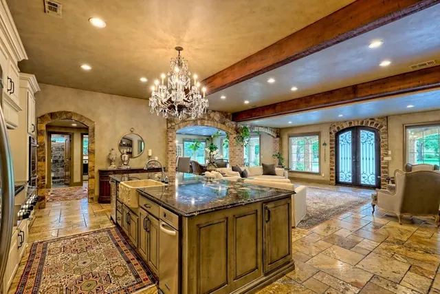 a spacious bedroom with a bed and a window