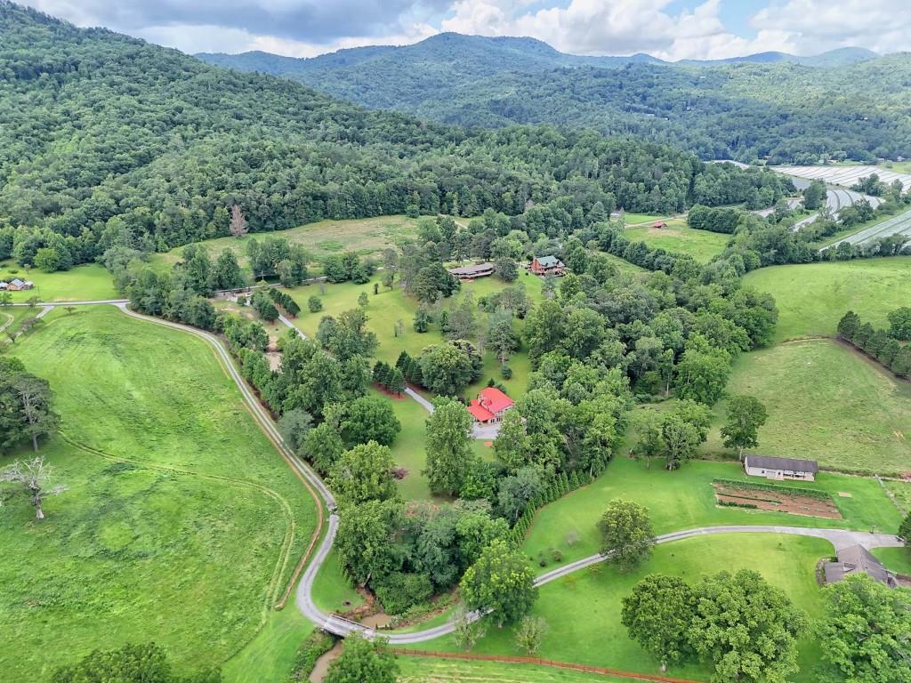 1422 Wolffork Road Rabun Gap, GA 30568 - Photo 73 of 78 an aerial view of green landscape with trees houses and mountain view