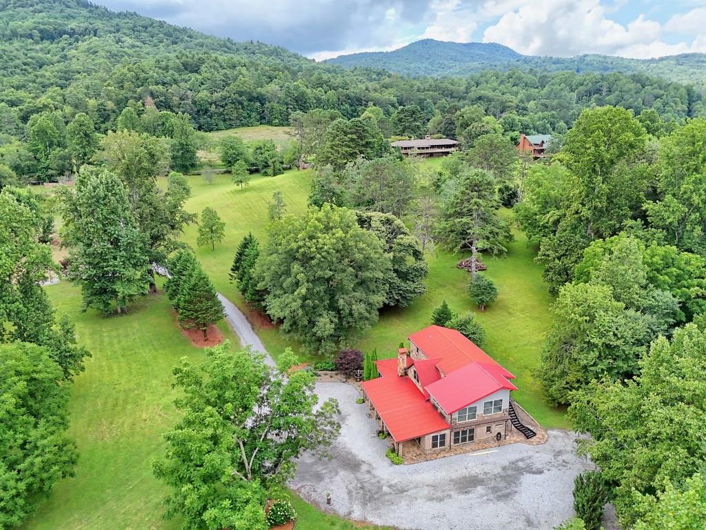1422 Wolffork Road Rabun Gap, GA 30568 - Photo 75 of 78 an aerial view of a house with a yard and lake view