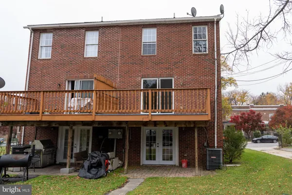 a view of a house with a balcony and sitting area