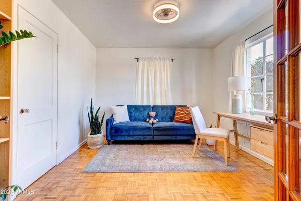 a living room with furniture and a rug