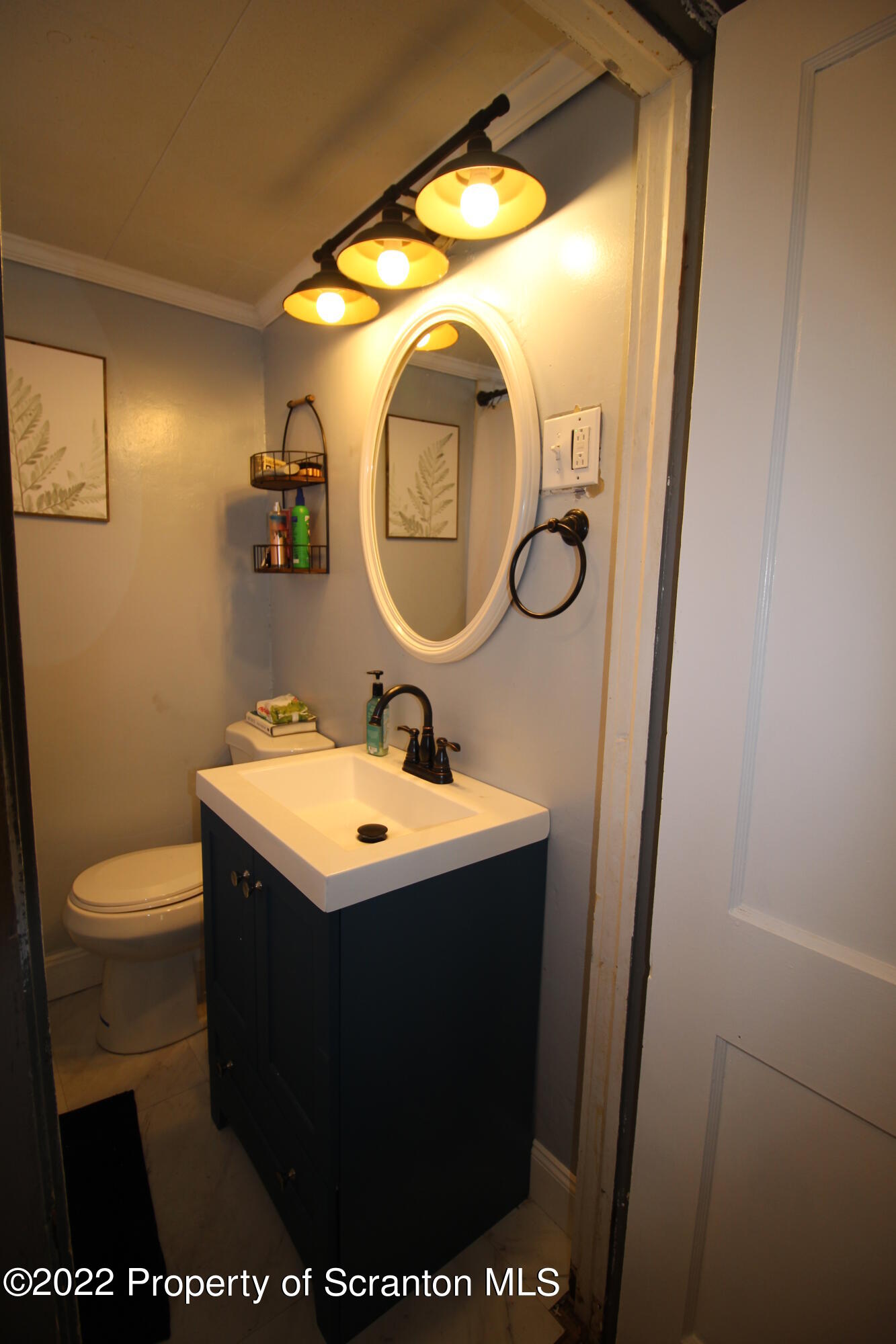 4001 Quicktown Road Moscow, PA 18444 - Photo 13 of 24 a bathroom with a sink and mirror with toilet