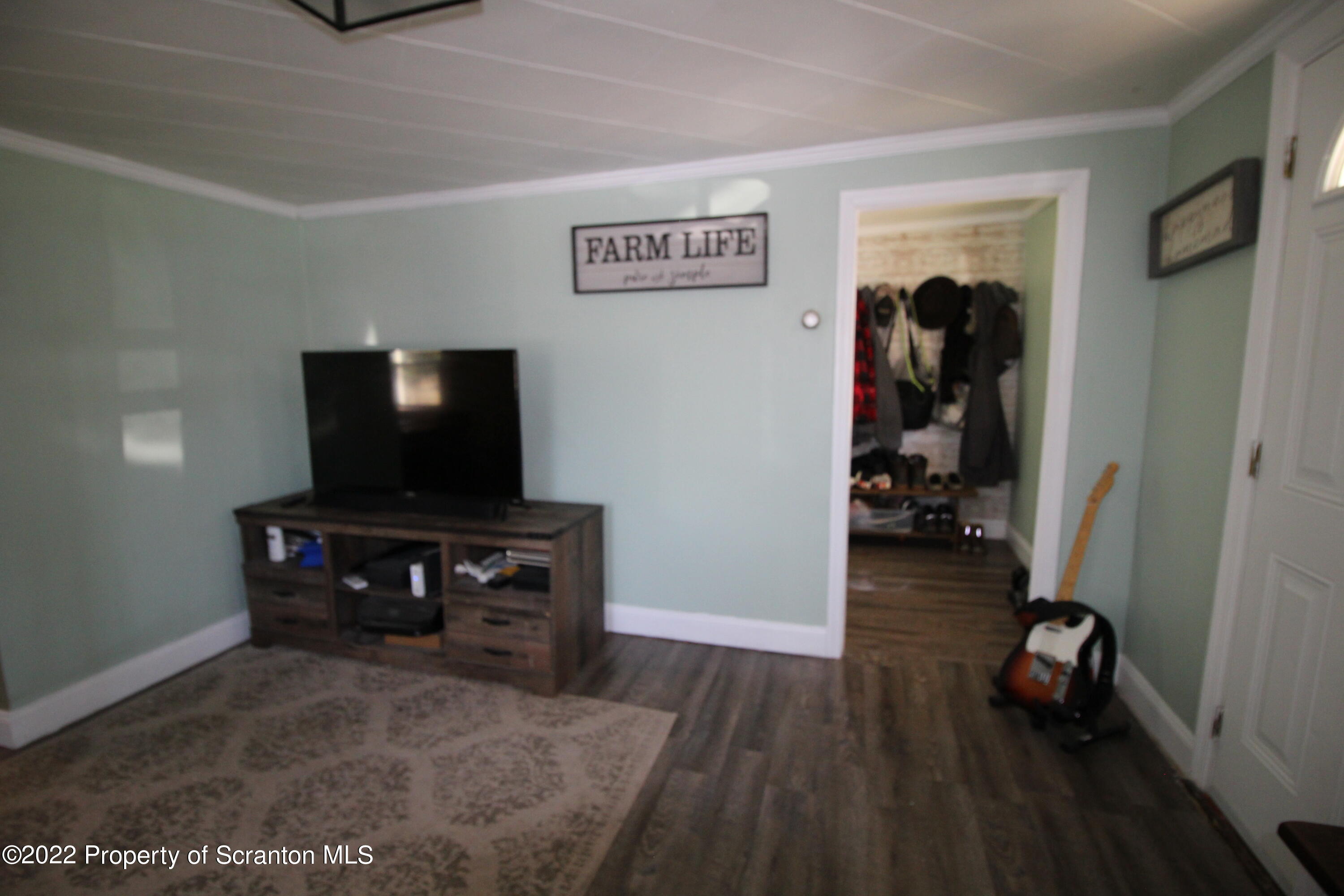 4001 Quicktown Road Moscow, PA 18444 - Photo 8 of 24 a view of a livingroom with furniture and an empty room