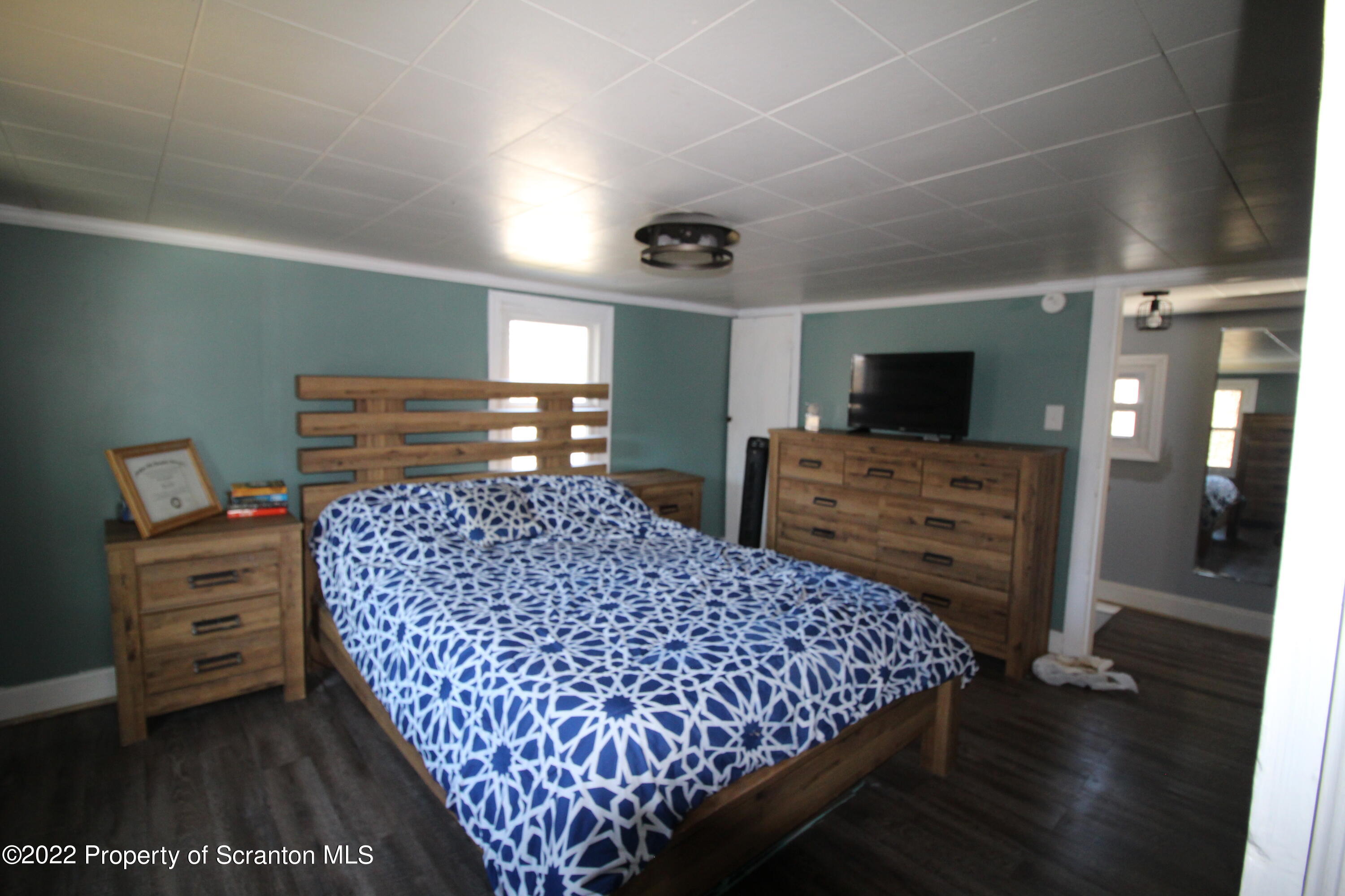 4001 Quicktown Road Moscow, PA 18444 - Photo 10 of 24 a bedroom with a bed and furniture