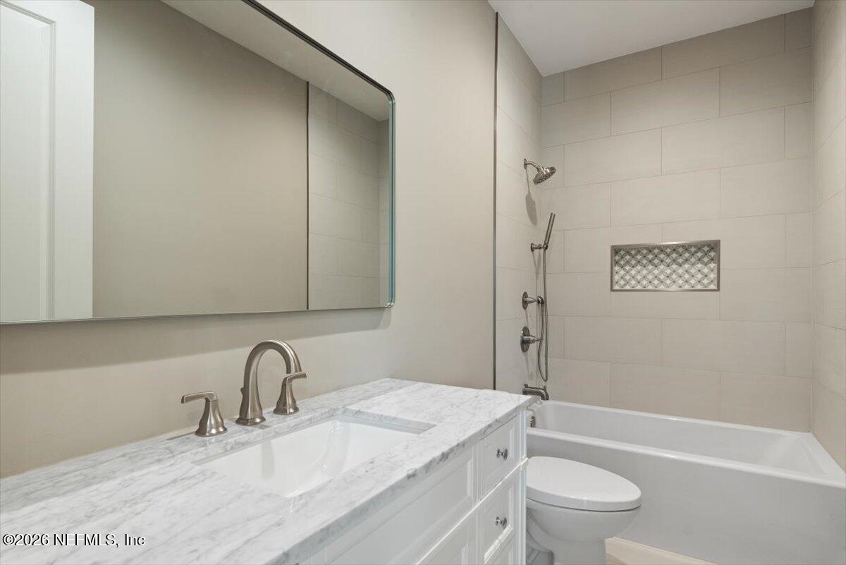 34883 Steeple Chase Way Callahan, FL 32011 - Photo 28 of 88 a bathroom with a granite countertop sink toilet and shower