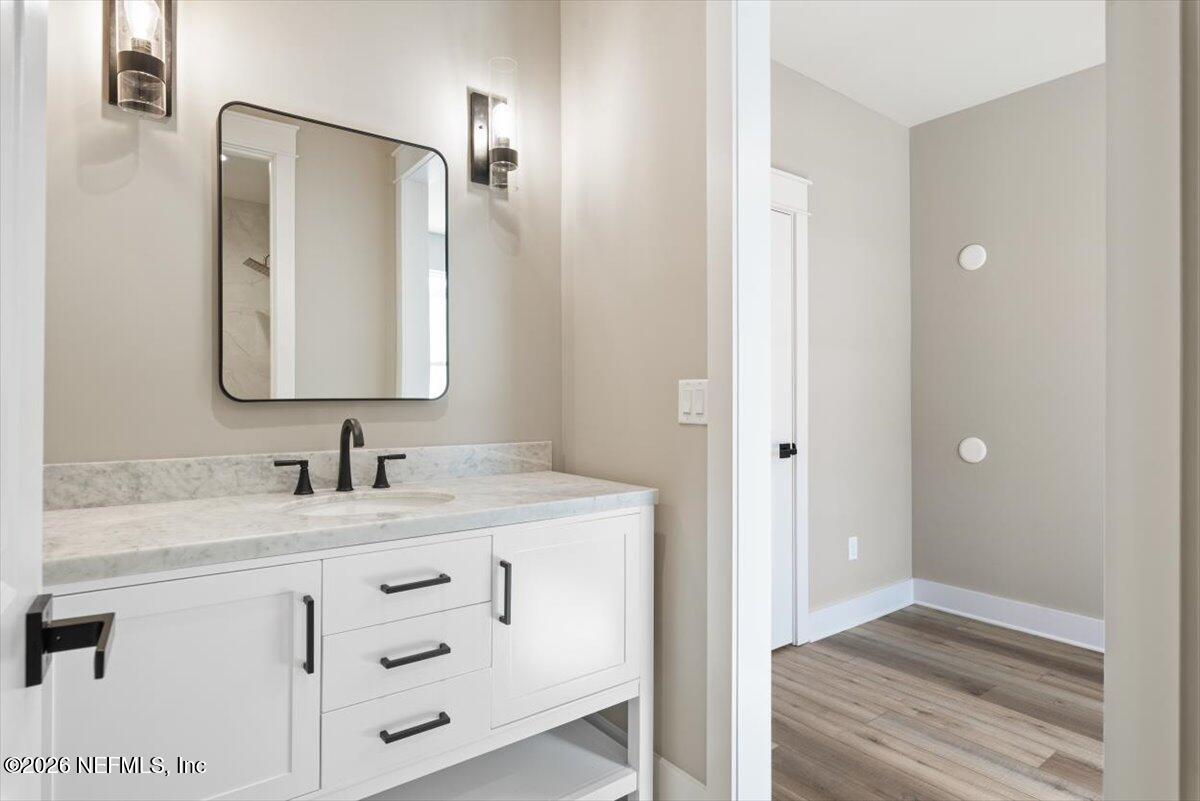 34883 Steeple Chase Way Callahan, FL 32011 - Photo 34 of 88 a bathroom with a sink and a mirror
