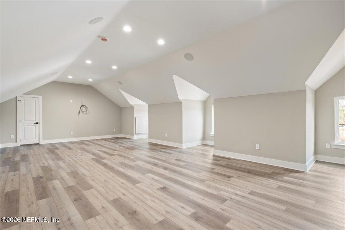34883 Steeple Chase Way Callahan, FL 32011 - Photo 38 of 88 a view of an empty room with wooden floor and closet