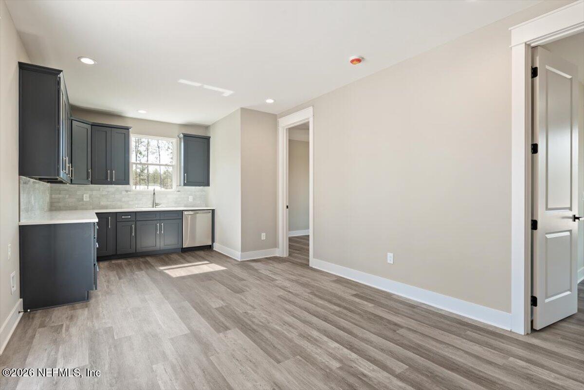 34883 Steeple Chase Way Callahan, FL 32011 - Photo 47 of 88 a view of a kitchen with wooden floor and a sink