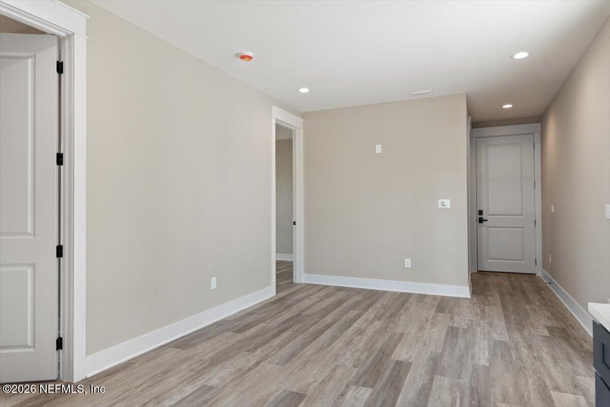 34883 Steeple Chase Way Callahan, FL 32011 - Photo 50 of 88 a view of an empty room with wooden floor and closet