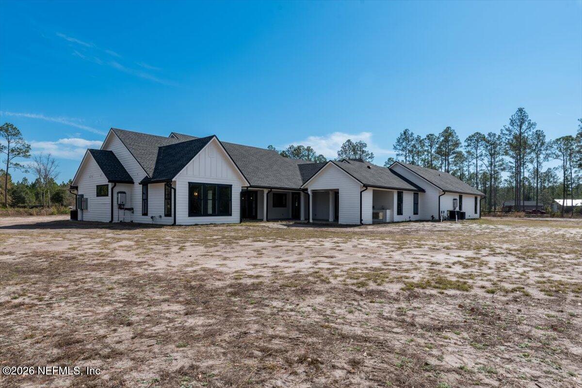 34883 Steeple Chase Way Callahan, FL 32011 - Photo 66 of 88 a front view of a house with a yard