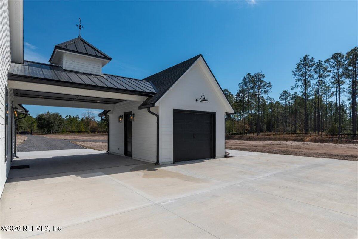 34883 Steeple Chase Way Callahan, FL 32011 - Photo 72 of 88 a view of a house with a garage