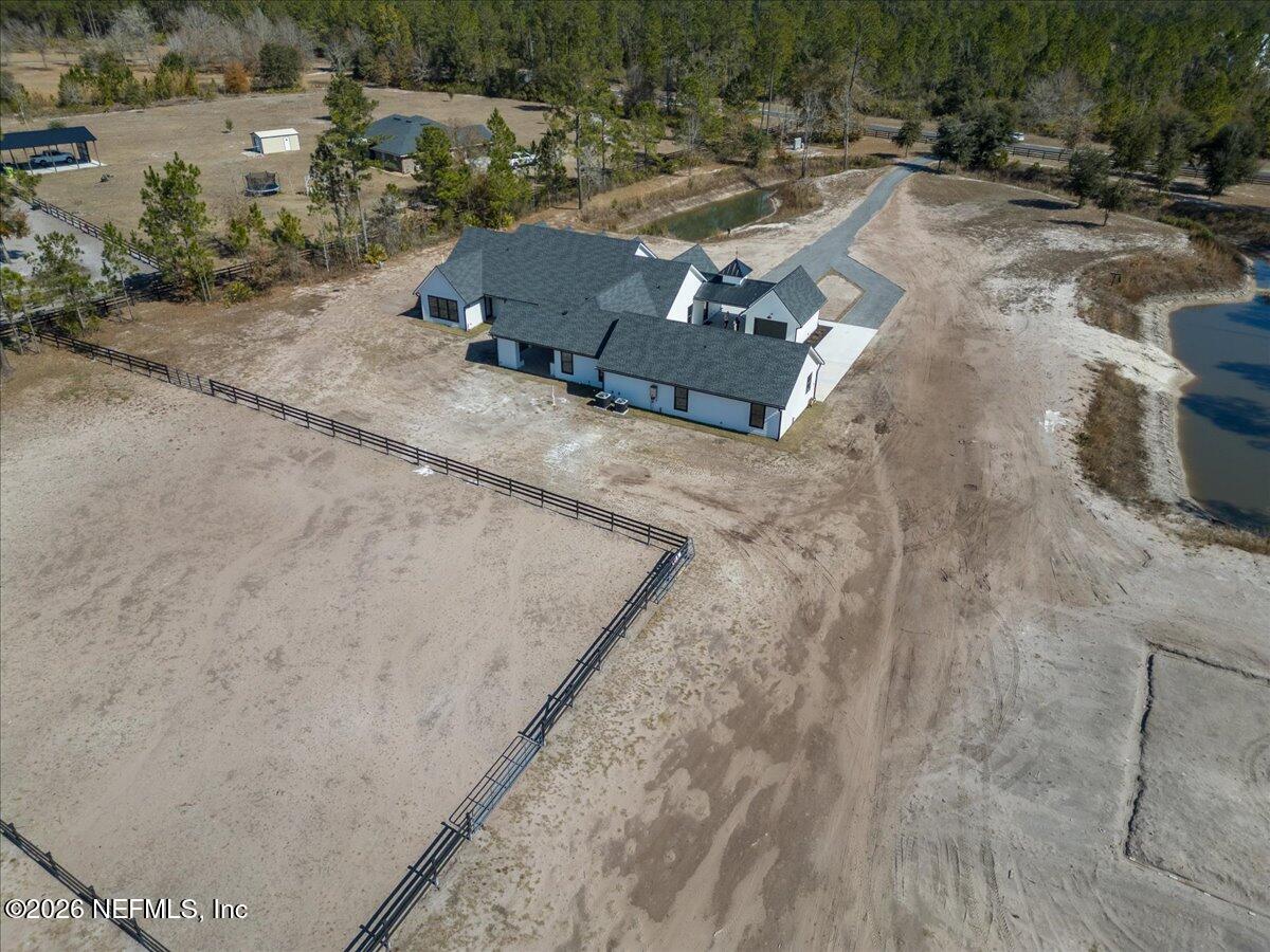 34883 Steeple Chase Way Callahan, FL 32011 - Photo 82 of 88 an aerial view of a yard with horses