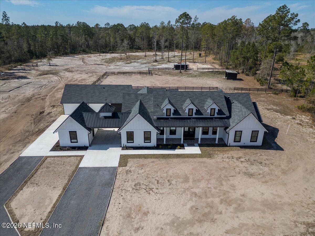 34883 Steeple Chase Way Callahan, FL 32011 - Photo 83 of 88 a view of a house with a yard and sitting area
