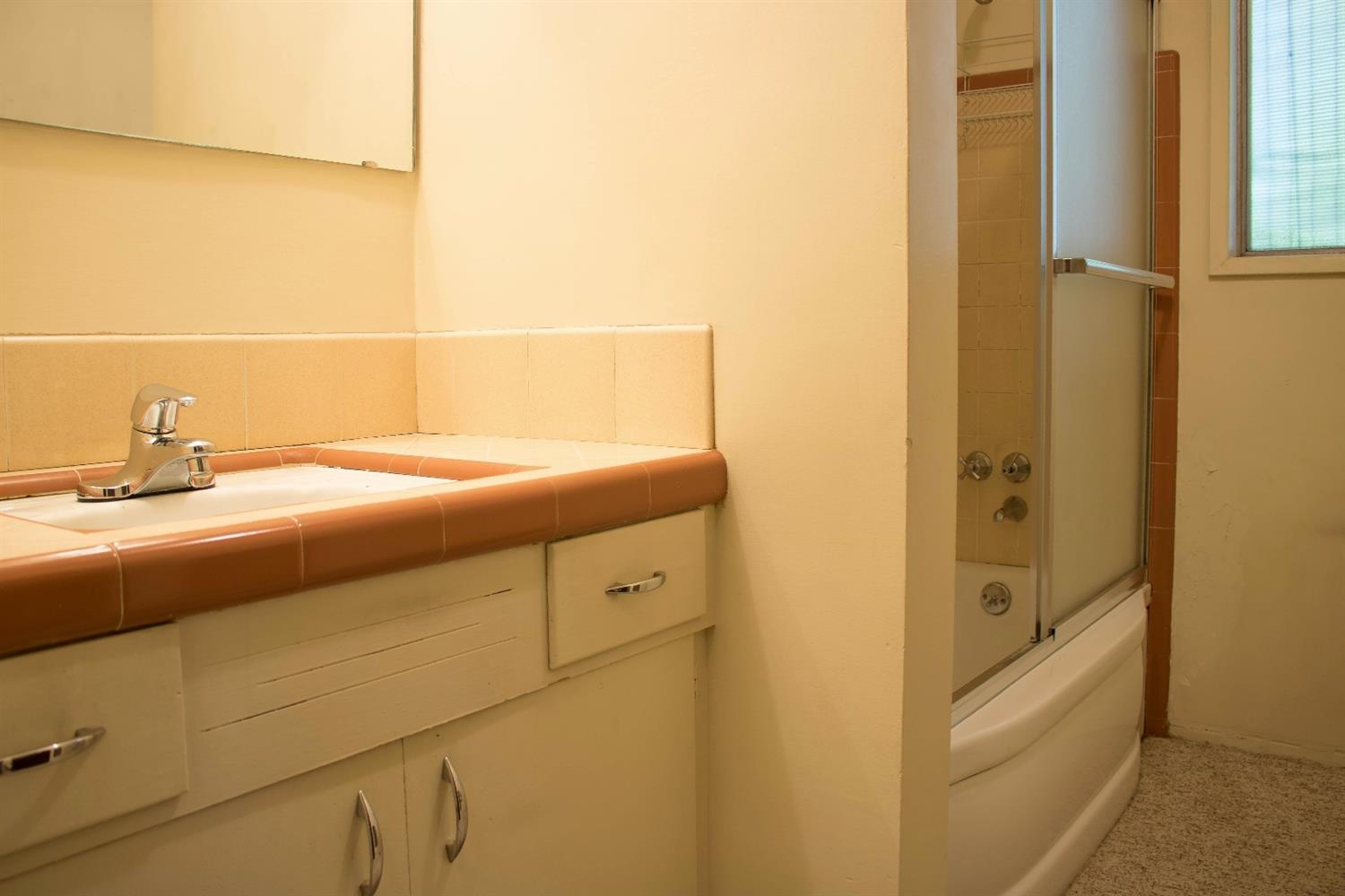 2613 Table Rock Road Medford, OR 97501 - Photo 10 of 23 a bathroom with a bathtub and a sink