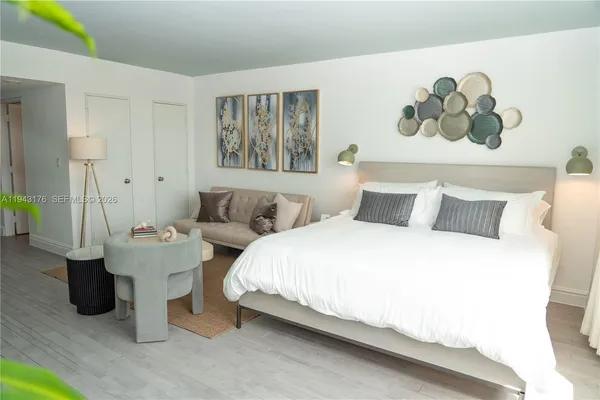 a bedroom with bed and a couch